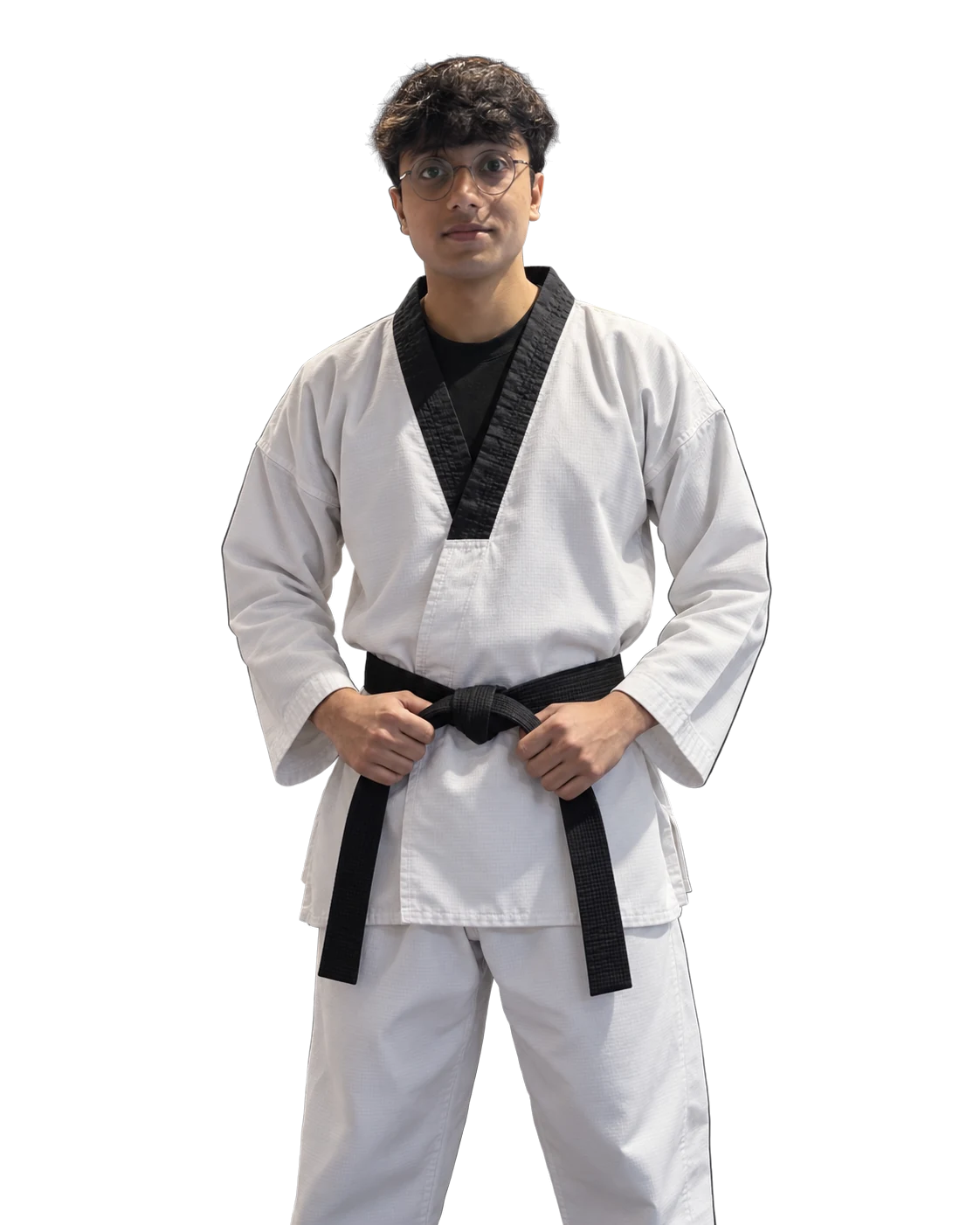 Syed Faaiz wearing a Taekwondo dobok and black belt
